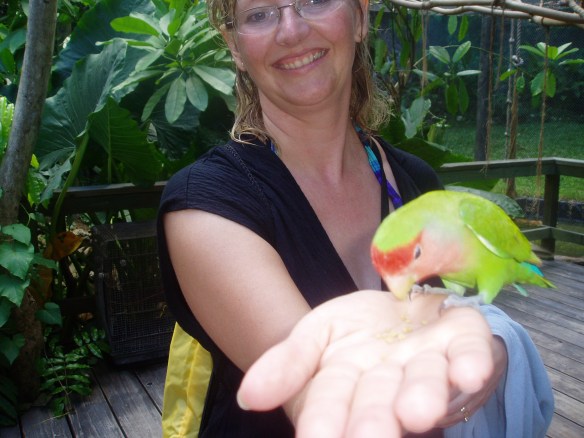 Christina holding a parrot